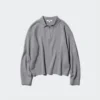 Løs polo-sweater i glat bomuld til kvinder