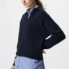 Løs polo-sweater i glat bomuld til kvinder