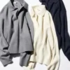 Løs polo-sweater i glat bomuld til kvinder