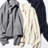 Løs polo-sweater i glat bomuld til kvinder
