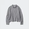 Løs polo-sweater i glat bomuld til kvinder
