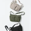 Unisex skuldertask med flere lommer