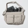 Unisex skuldertask med flere lommer